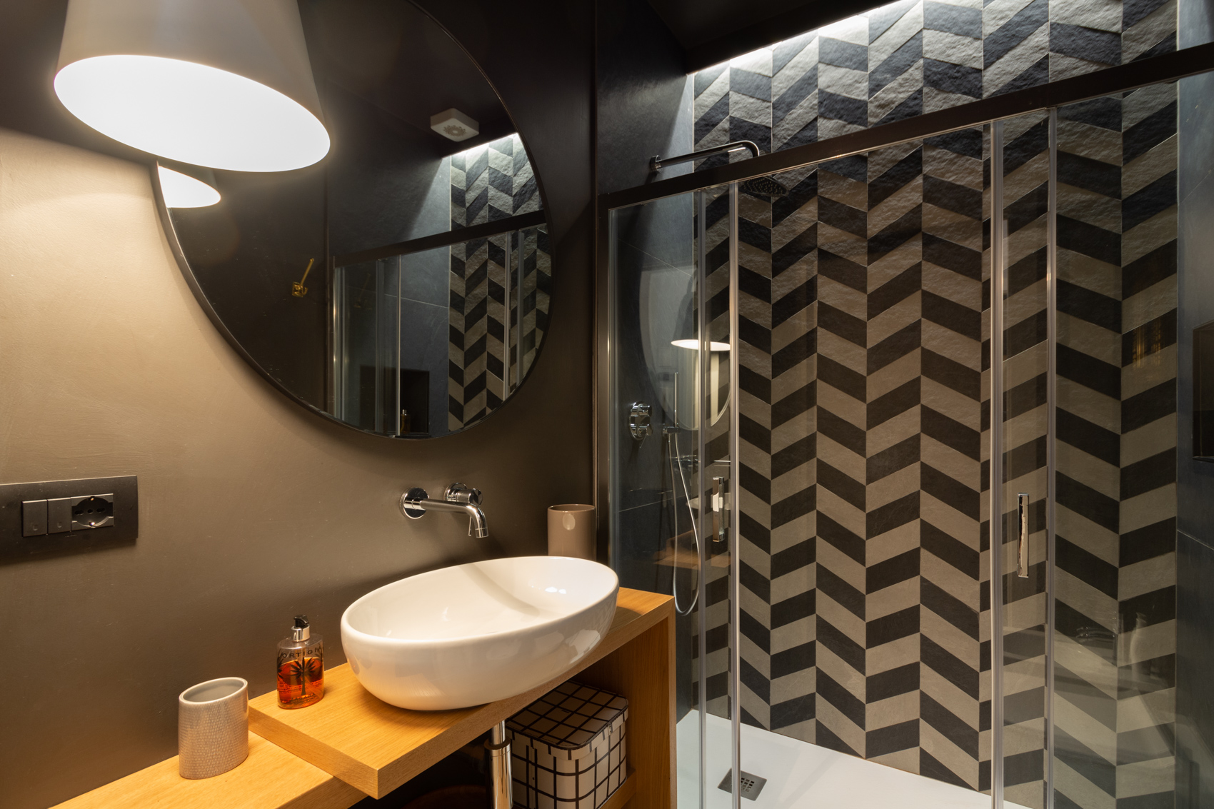 Bathroom one, alternate view of basin and herringbone shower