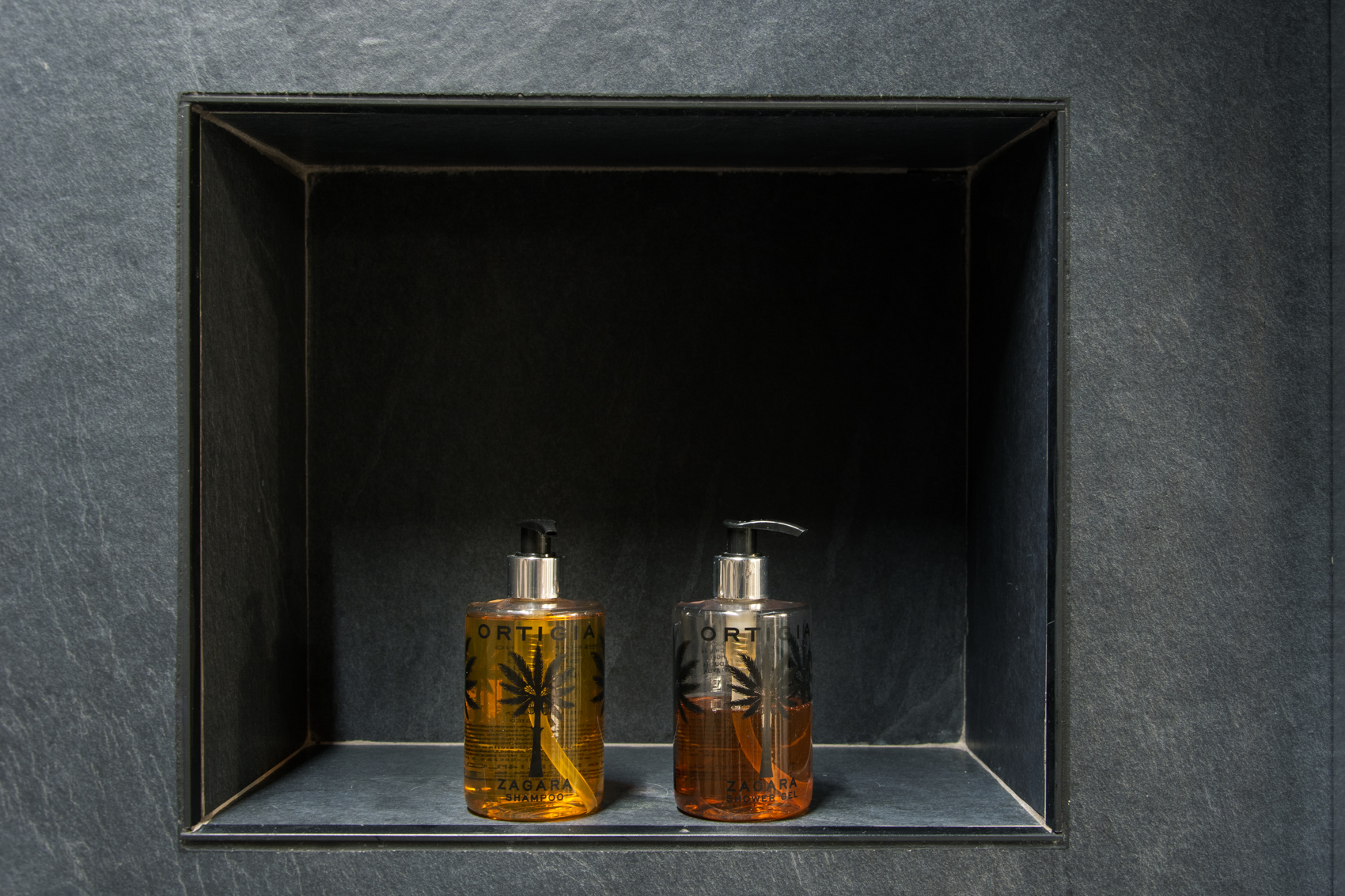Slate shower niche with Ortigia amenity bottles