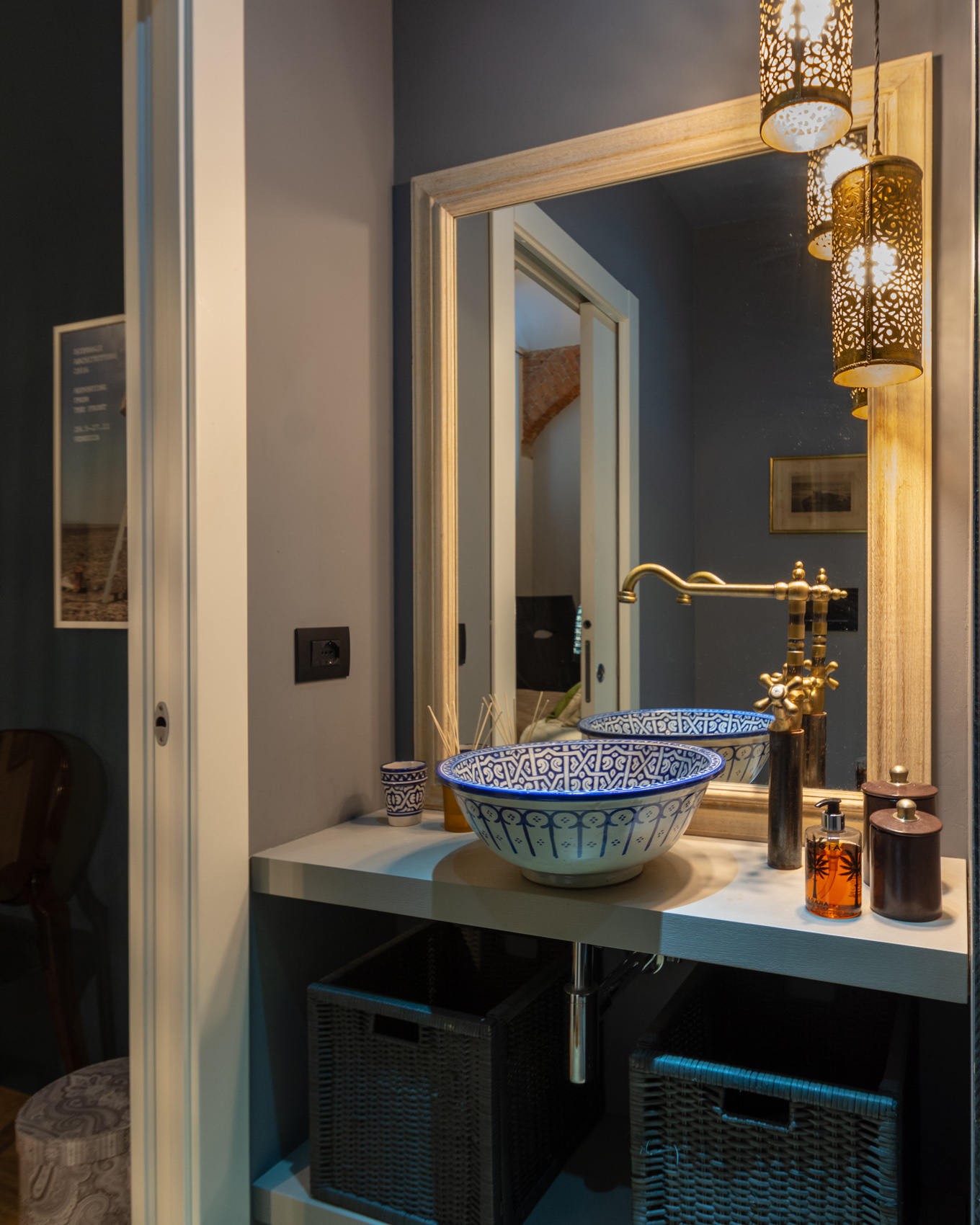 Second bathroom with hand-painted blue basin and brass tap